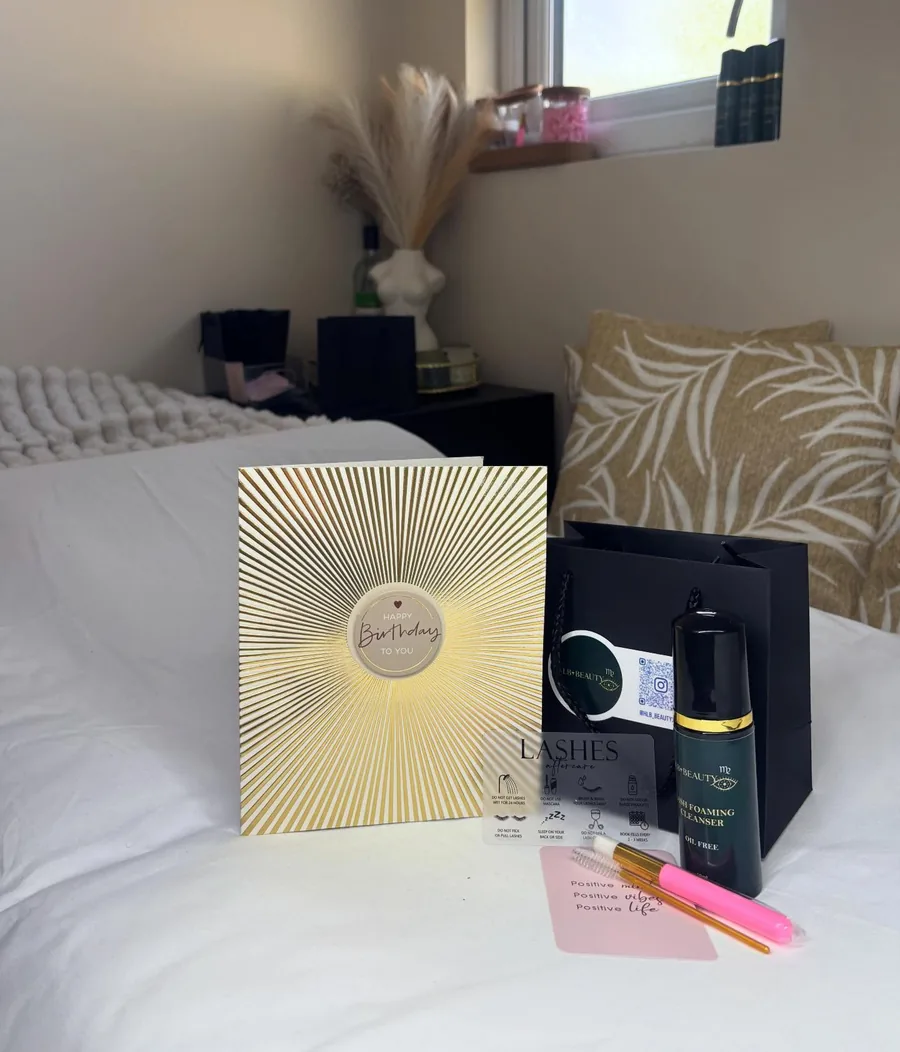HLB Beauty studio products laid out on the treatment bed